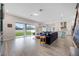 Bright open living space with a modern kitchen and a sliding door to the backyard at 2011 Soaring Oak Way, Winter Park, FL 32792