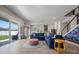 Spacious living room with an open floor plan, connecting to a modern kitchen and outdoor patio at 2011 Soaring Oak Way, Winter Park, FL 32792