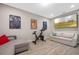 Modern living room with a comfortable sofa, exercise bike and a wall-mounted television at 2011 Soaring Oak Way, Winter Park, FL 32792