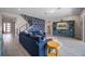 Modern living room with a unique statement wall and an open staircase design at 2011 Soaring Oak Way, Winter Park, FL 32792