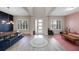 Bright, open-concept living space with modern finishes, unique decor, and ample natural light at 2011 Soaring Oak Way, Winter Park, FL 32792