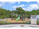 Community playground featuring slides and climbing structures, surrounded by lush landscaping at 2011 Soaring Oak Way, Winter Park, FL 32792