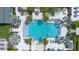 Overhead view of the community's inviting swimming pool, surrounded by palm trees and lounge chairs for relaxation at 2011 Soaring Oak Way, Winter Park, FL 32792
