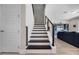 Modern staircase featuring dark wood steps and an open railing system at 2011 Soaring Oak Way, Winter Park, FL 32792