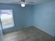 Bedroom featuring tile floors and a window providing natural light at 214 Magellan Dr, Kissimmee, FL 34758