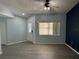Bright living room with vinyl floors, a ceiling fan, and a window at 214 Magellan Dr, Kissimmee, FL 34758