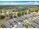 Stunning aerial view of homes near a golf course, nestled among lush trees and manicured lawns at 231 Cherokee Hill Ct, Deland, FL 32724