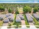 Charming neighborhood with houses nestled near a golf course, featuring mature trees and manicured lawns at 231 Cherokee Hill Ct, Deland, FL 32724