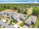 Beautiful aerial view of well-maintained homes with solar panels, featuring lovely landscaping and driveways at 231 Cherokee Hill Ct, Deland, FL 32724