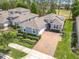 Beautiful single-story home with paver driveway and lush landscaping, located near a golf course at 231 Cherokee Hill Ct, Deland, FL 32724