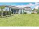 Spacious backyard with green lawn, perfect for activities or relaxing near the patio at 231 Cherokee Hill Ct, Deland, FL 32724