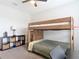 Bedroom featuring wooden bunk bed, desk, and soft carpet at 231 Cherokee Hill Ct, Deland, FL 32724