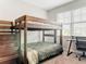 Bedroom featuring wooden bunk bed, desk, and soft carpet at 231 Cherokee Hill Ct, Deland, FL 32724