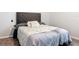 Comfortable bedroom featuring a plush bed with a tufted headboard and soft linens at 231 Cherokee Hill Ct, Deland, FL 32724