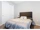 Bedroom featuring closet, soft carpet and plush bed with a tufted headboard at 231 Cherokee Hill Ct, Deland, FL 32724