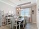 Dining room showcasing an elegant chandelier, modern decor, and stylish furnishings at 231 Cherokee Hill Ct, Deland, FL 32724