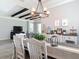 Open dining and living area featuring modern decor and stylish wood-look tile flooring at 231 Cherokee Hill Ct, Deland, FL 32724