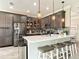 Modern kitchen featuring sleek cabinets, stainless steel appliances, a quartz countertop, and pendant lighting at 231 Cherokee Hill Ct, Deland, FL 32724