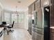 Office space featuring a large stainless steel refrigerator and stainless steel storage in an open layout at 231 Cherokee Hill Ct, Deland, FL 32724
