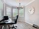 Office space with bay windows for natural light, modern furnishings, and neutral tones at 231 Cherokee Hill Ct, Deland, FL 32724