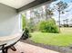 Relaxing outdoor patio featuring brick pavers, a cozy hammock, and a lush green backyard view at 231 Cherokee Hill Ct, Deland, FL 32724