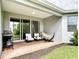 Inviting patio with comfortable seating, a hammock, and a grill, perfect for outdoor entertaining at 231 Cherokee Hill Ct, Deland, FL 32724