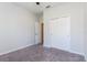 Bedroom with carpet, ceiling fan, closet and entry to bathroom at 2430 Sanderling St, Haines City, FL 33844