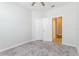 Bedroom with neutral carpet, closet and entry to bathroom at 2430 Sanderling St, Haines City, FL 33844