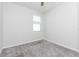 Bedroom with neutral carpet and windows providing natural light at 2430 Sanderling St, Haines City, FL 33844
