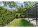 The private backyard boasts mature landscaping and a lawn at 25813 Feather Ridge Ln, Sorrento, FL 32776