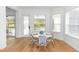 Cozy breakfast nook features an inviting table setting and an abundance of natural light at 25813 Feather Ridge Ln, Sorrento, FL 32776