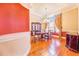 Formal dining room with hardwood floors, a chandelier, and large windows with decorative curtains at 25813 Feather Ridge Ln, Sorrento, FL 32776