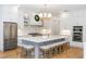 Spacious gourmet kitchen boasts a large island, stainless steel appliances, and stylish finishes at 25813 Feather Ridge Ln, Sorrento, FL 32776
