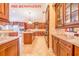 Spacious kitchen with granite countertops, custom cabinetry, and stainless steel appliances at 25813 Feather Ridge Ln, Sorrento, FL 32776
