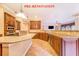 Open-concept kitchen with granite countertops, stainless steel appliances, and ample cabinet space at 25813 Feather Ridge Ln, Sorrento, FL 32776