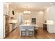 Spacious kitchen boasts a large island with seating, stainless steel appliances and ample cabinet space at 25813 Feather Ridge Ln, Sorrento, FL 32776
