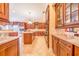 Spacious kitchen with granite countertops, custom cabinetry, and stainless steel appliances at 25813 Feather Ridge Ln, Sorrento, FL 32776