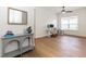 Bright office space with hardwood floors, natural light, a desk, and decorative accents at 25813 Feather Ridge Ln, Sorrento, FL 32776