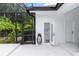 Covered outdoor patio includes a convenient pool bath, outdoor shower, and access to the backyard at 25813 Feather Ridge Ln, Sorrento, FL 32776