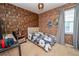 Bedroom showcasing Harry Potter theme, including faux brick wall, and window with gray curtains at 2659 Calistoga Ave, Kissimmee, FL 34741