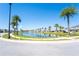 Beautiful community view with lake, palm trees and sidewalks on a sunny day at 2659 Calistoga Ave, Kissimmee, FL 34741