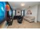Entertainment room featuring comfortable seating, wall art, and entertainment setup at 2659 Calistoga Ave, Kissimmee, FL 34741