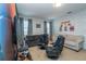Entertainment room featuring comfortable seating, wall art, and entertainment setup at 2659 Calistoga Ave, Kissimmee, FL 34741