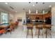Spacious kitchen with granite countertops, an island bar, and a dining area overlooking the patio at 2659 Calistoga Ave, Kissimmee, FL 34741