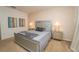 Inviting main bedroom featuring plush carpet, decorative wall art, and comfortable furnishings at 2659 Calistoga Ave, Kissimmee, FL 34741