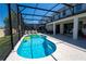 Pool with inflatable toys, and screened in enclosure featuring multiple lounge chairs at 2659 Calistoga Ave, Kissimmee, FL 34741