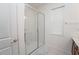 Modern bathroom featuring glass-enclosed shower, tiled walls, and a bright, clean design at 2659 Calistoga Ave, Kissimmee, FL 34741