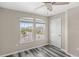 Neutral bedroom with ample natural light from the large double windows at 2694 Giardino Loop, Kissimmee, FL 34741