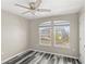 This spare bedroom features large windows and a ceiling fan at 2694 Giardino Loop, Kissimmee, FL 34741