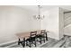 Dining room featuring a modern chandelier and an open floor plan at 2694 Giardino Loop, Kissimmee, FL 34741